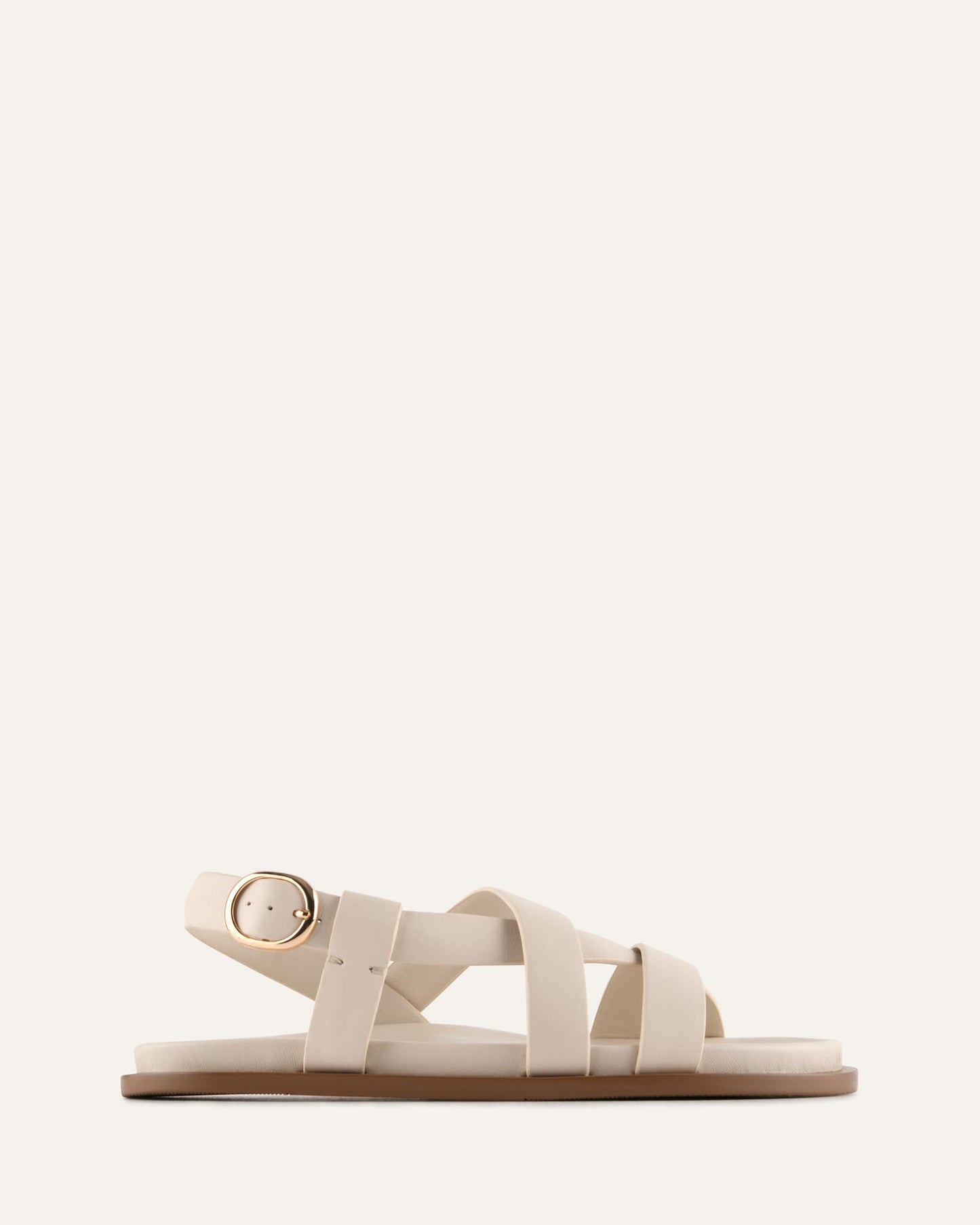 White sandal with a strap design on a white background