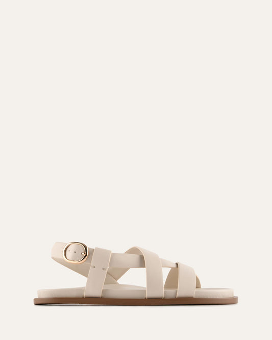 White sandal with a strap design on a white background