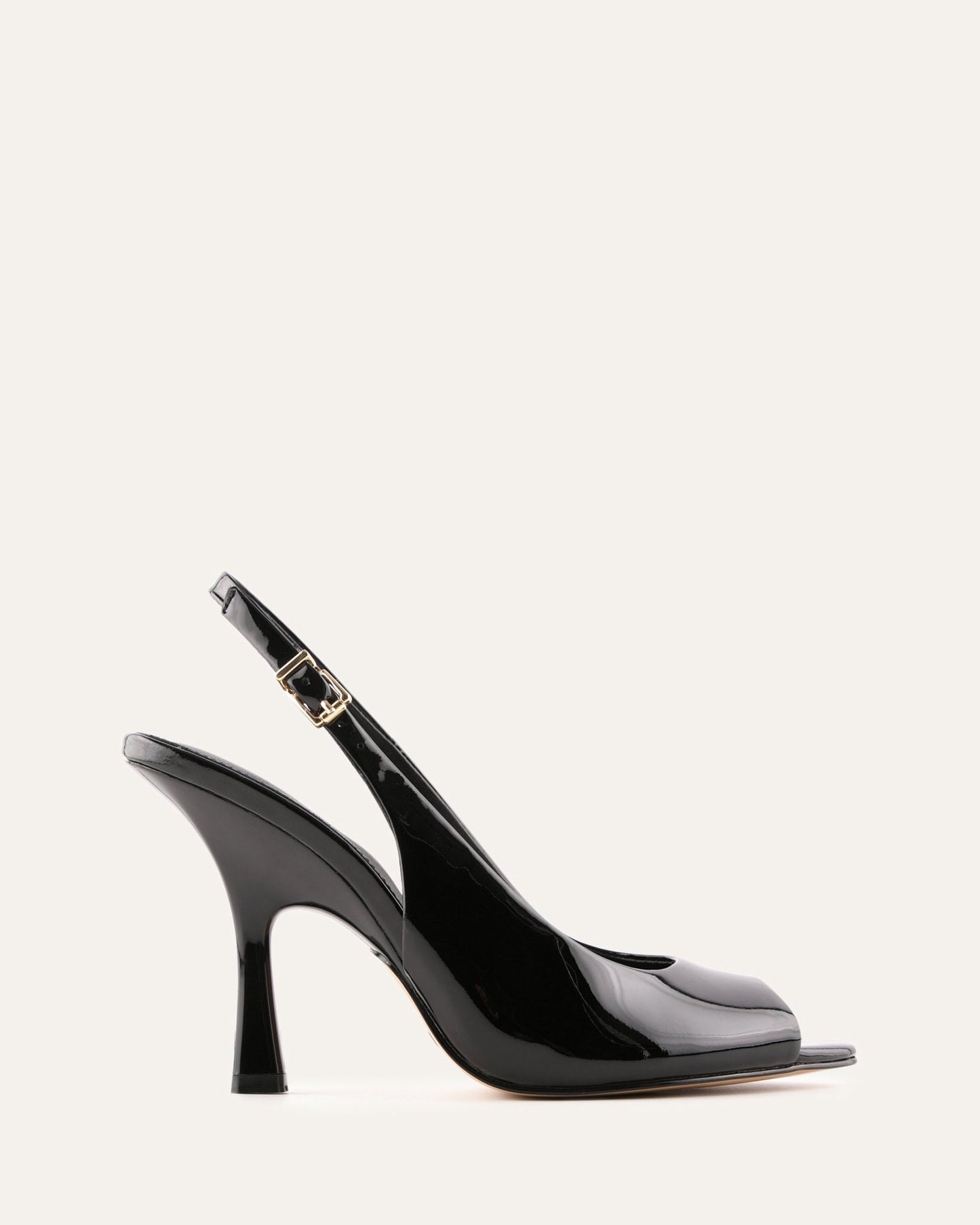 Black high-heeled shoe with a slingback design on a white background