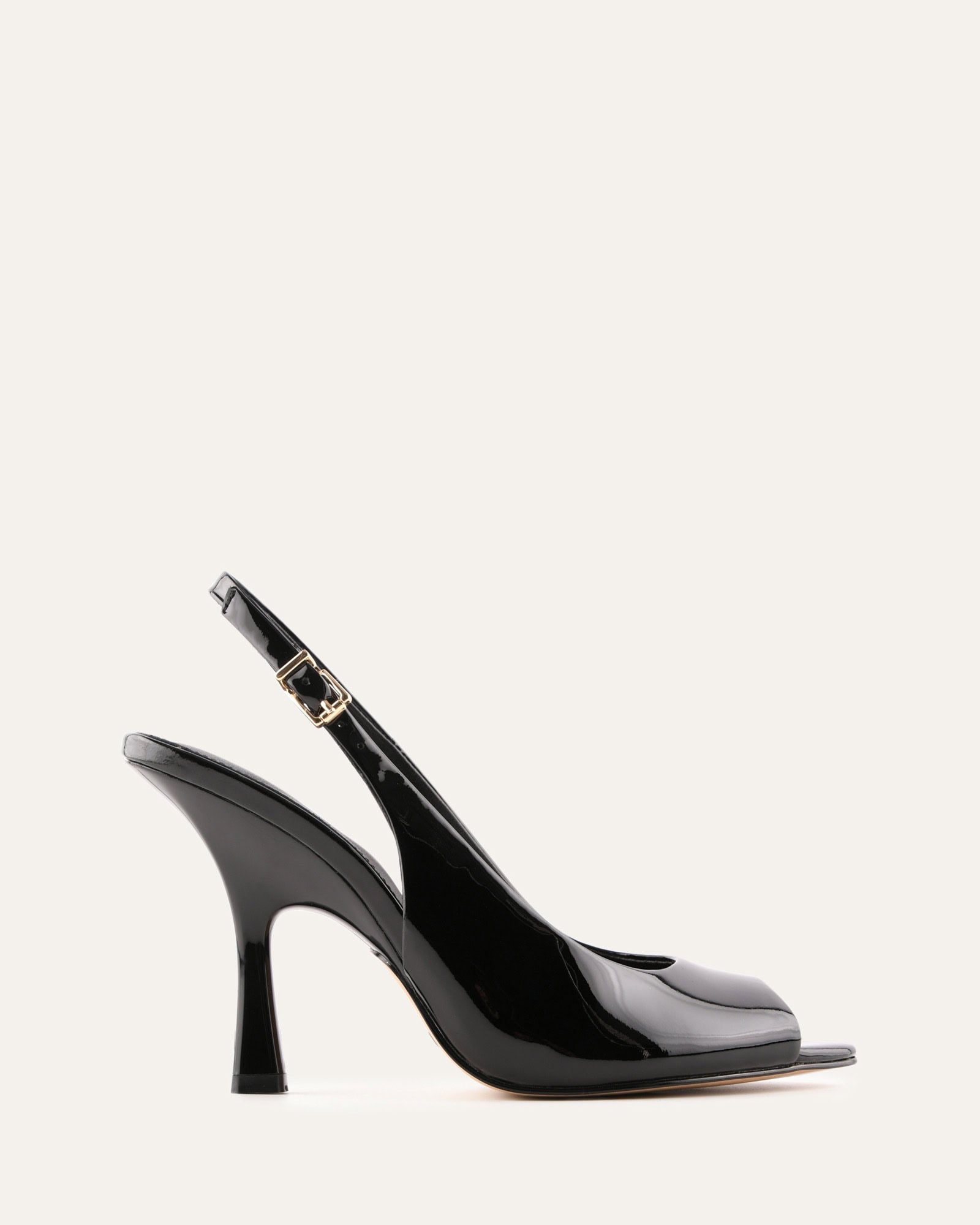 Black high-heeled shoe with a slingback design on a white background
