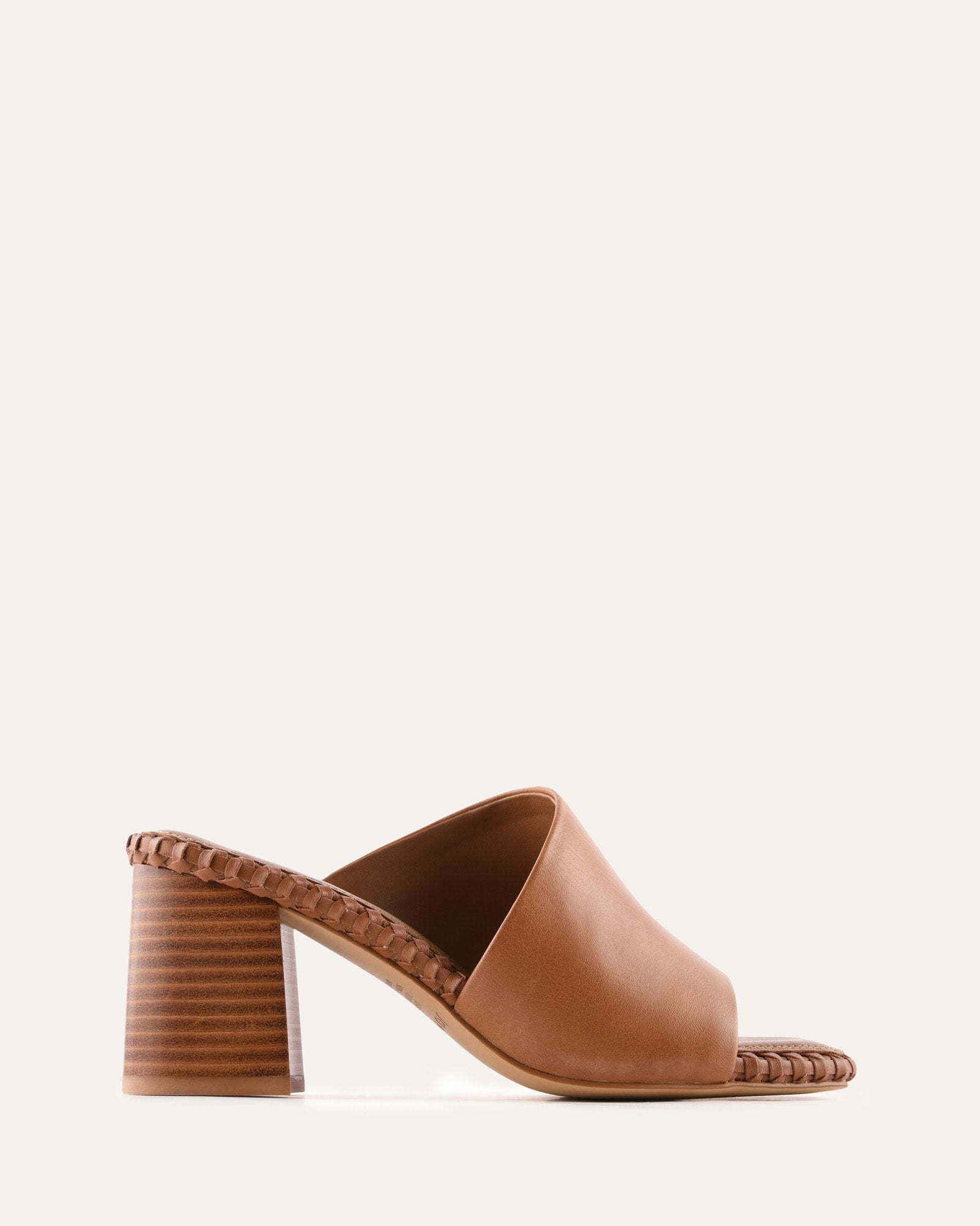 Brown open-toe sandal with a block heel on a white background