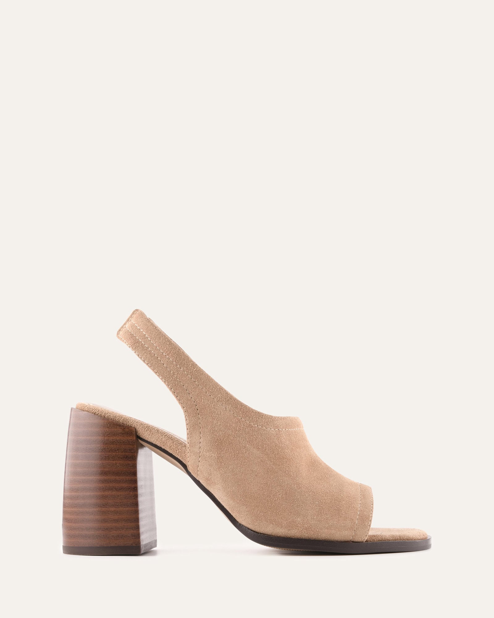 Beige sandal with a wooden heel on a white background