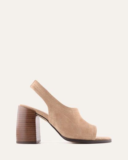 Beige sandal with a wooden heel on a white background
